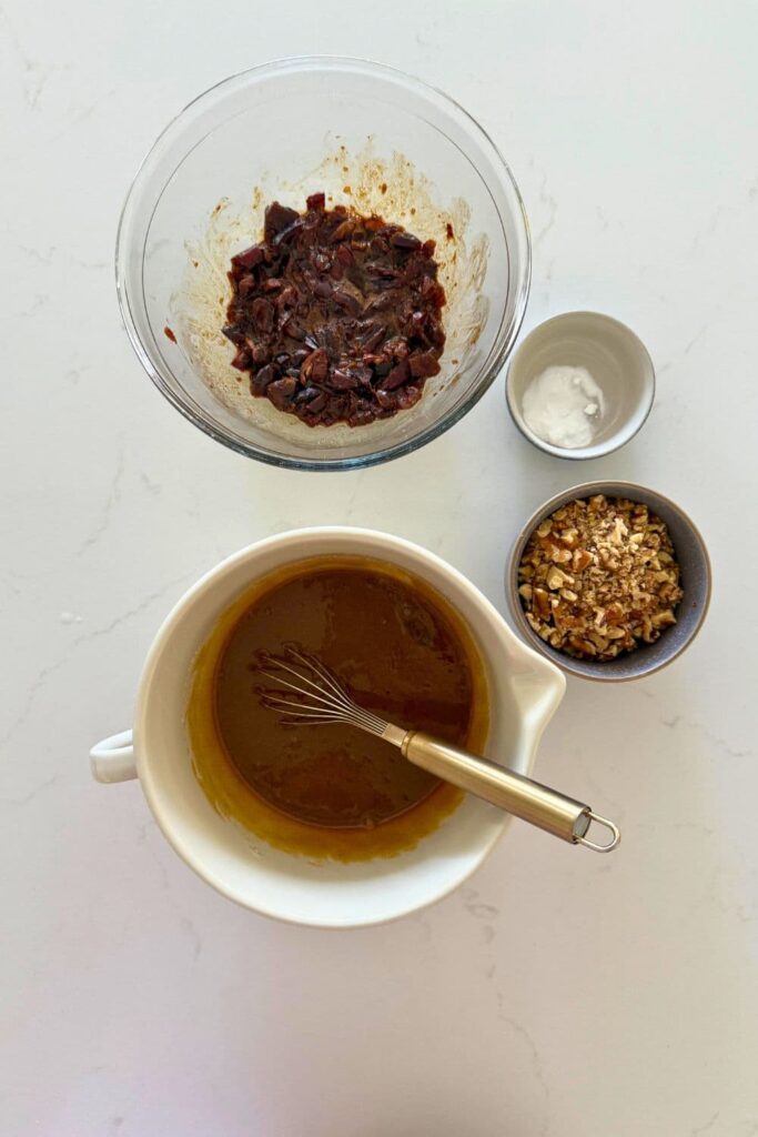 Mixing the wet ingredients to make sourdough date and walnut cookies.