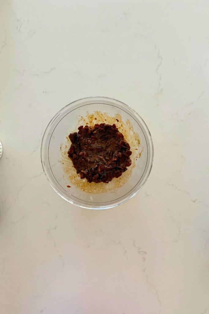 Dates soaking in coffee mixture to make sourdough date and walnut cookies.