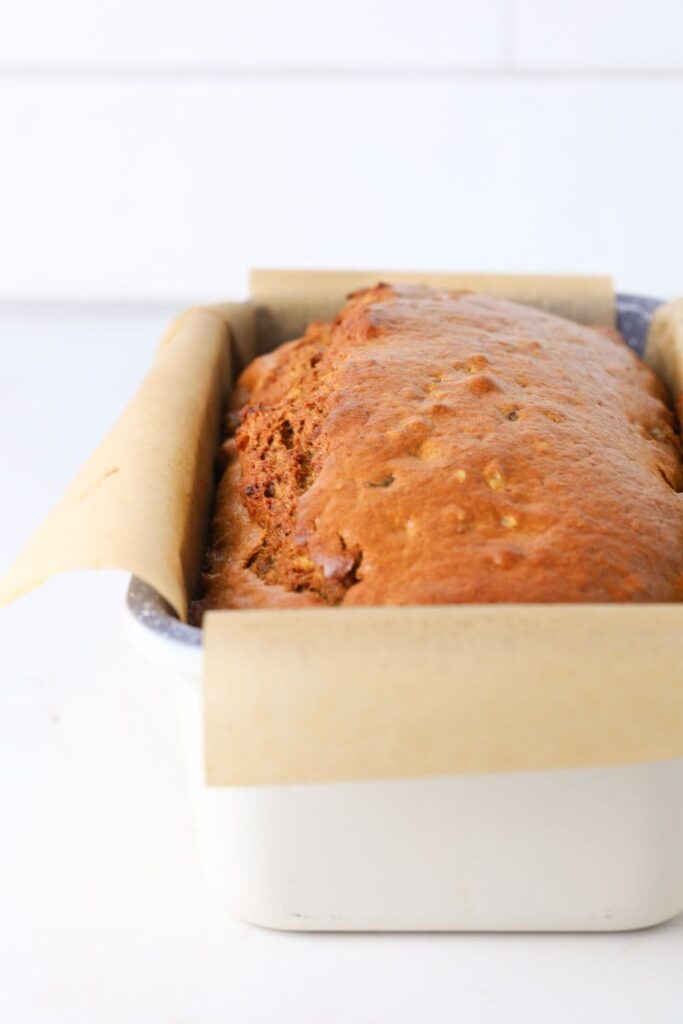 Sourdough date and walnut loaf cake fresh baked in loaf pan.