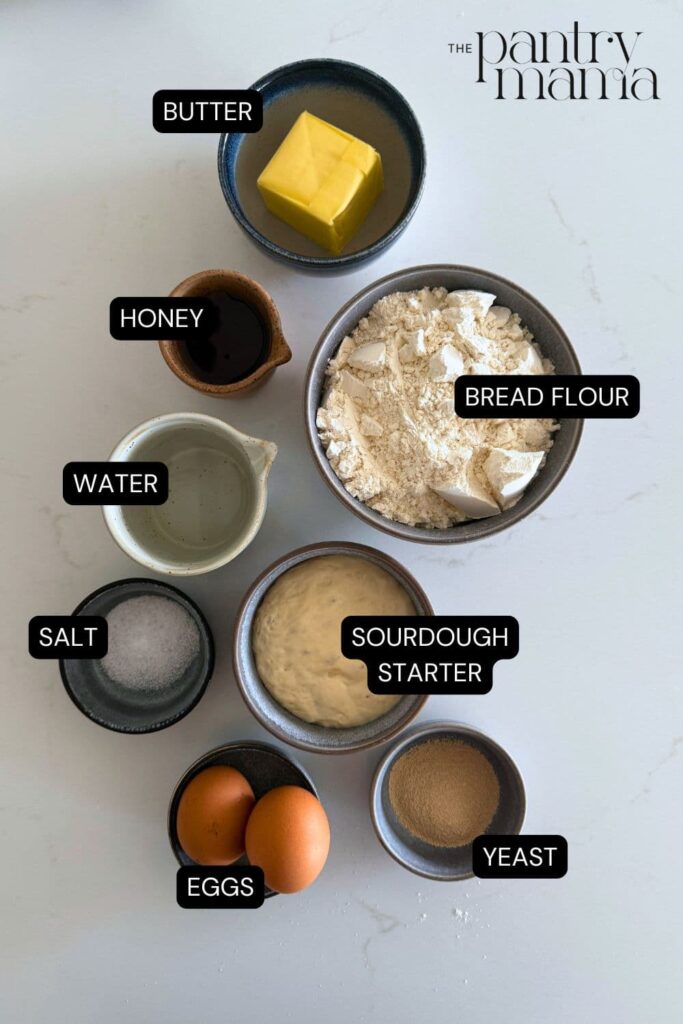 Flat lay of ingredients necessary to make sourdough discard honey butter rolls.