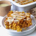 Slice of sourdough pumpkin pie baked oatmeal on a plate.