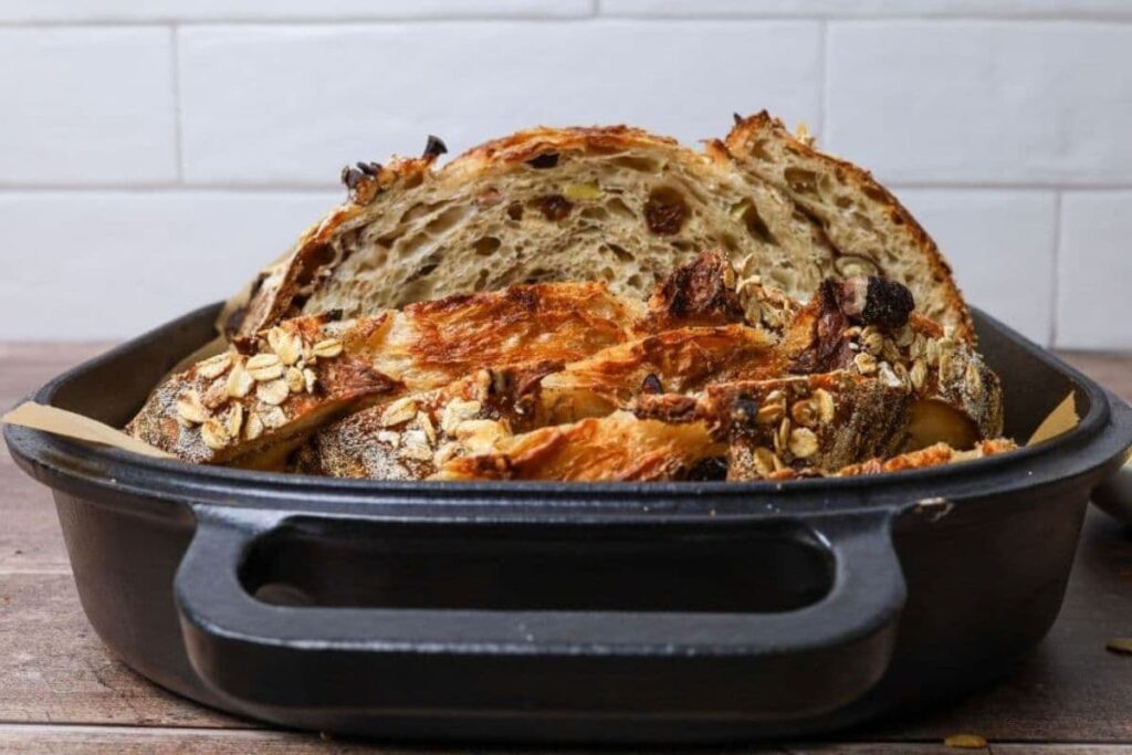 Sourdough apple crisp loaf in a baking pan.