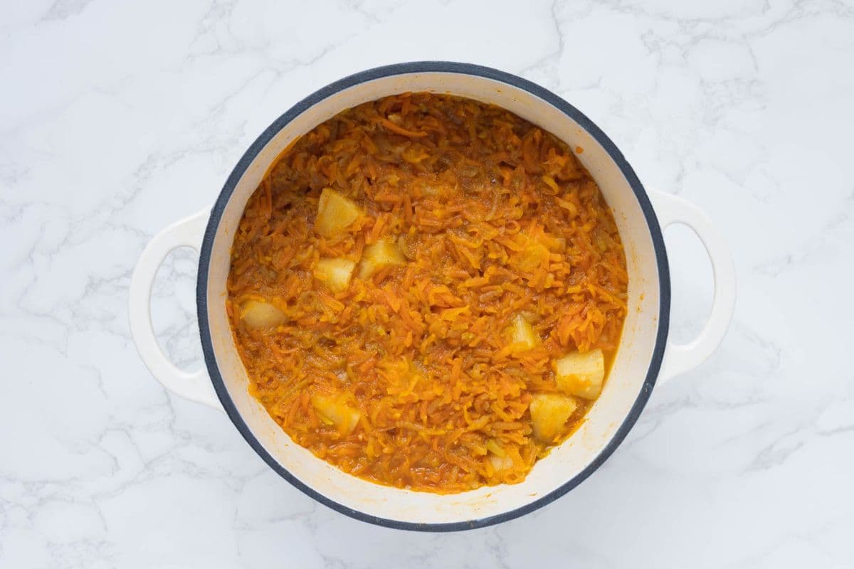 Cooked ingredients in a pot just before blending to make carrot cake jam.