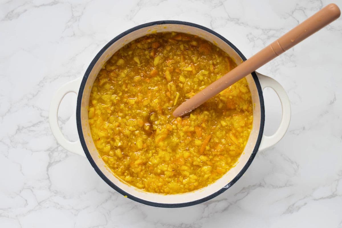 A pot with the ingredients for shortcut orange marmalade, ready to cook.